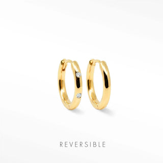 Simple gold hoop earrings highlighting smooth curved profile
